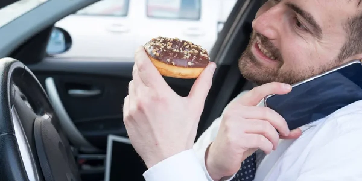 depositphotos_146448827-stock-photo-man-eating-a-doughnut-and
